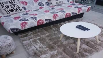 Suíte estúdio urbana | Área de estar | TV de plasma