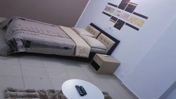 Suíte estúdio urbana | 1 quarto, escrivaninha, ferros/tábuas de passar roupa, Wi-Fi de cortesia