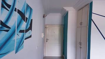 Suíte estúdio conforto | Área de estar | TV de plasma