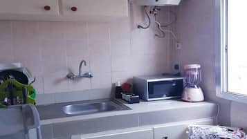 Suíte estúdio conforto | Cozinha privada | Geladeira grande, micro-ondas, fogão, cooktop