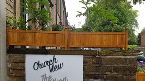 A sign reading "Church View The Old Albion" on a stone wall. - Church View (Huddersfield)