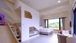 A modern hotel room with a staircase, a bed, a sofa, and a large window offering a view of greenery. - Take Sunny B&B (Shoufeng)