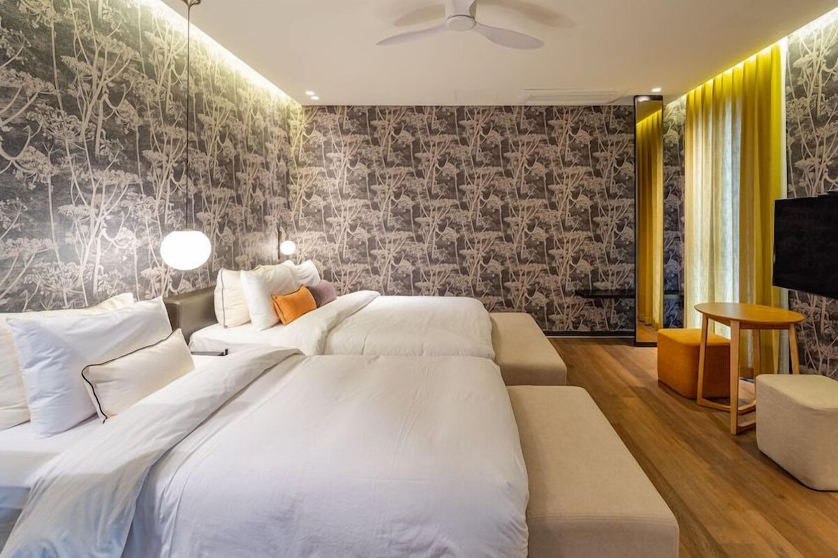 Premium bedding, desk, laptop workspace, free WiFi