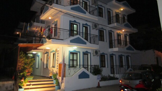 A multi-story hotel with balconies and a staircase leading to the entrance. - Vural Apart Hotel (Cesme)