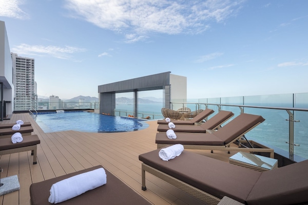 Outdoor pool, open 6:00 AM to 10:00 PM, pool loungers
