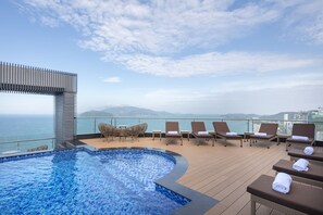 Outdoor pool, open 6:00 AM to 10:00 PM, pool loungers