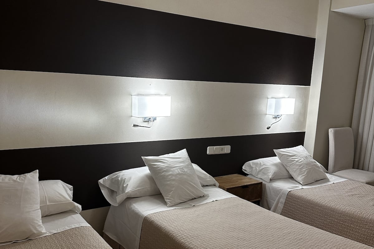 Standard Triple Room, City View | 1 bedroom, desk, free WiFi, bed sheets