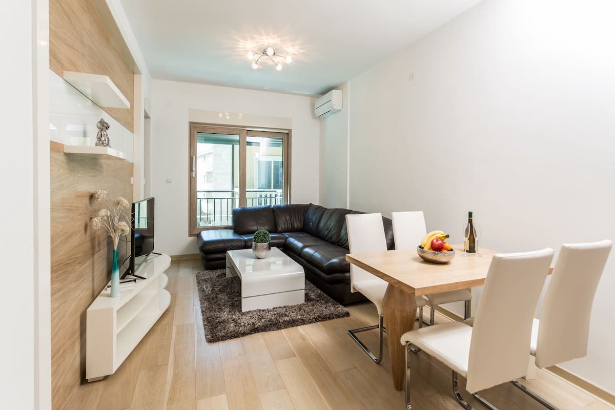 Deluxe Apartment, 1 Bedroom | Living area | LCD TV