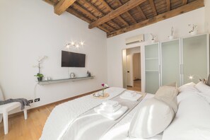 Departamento | 1 habitación, tabla de planchar con plancha, wifi gratis y ropa de cama 