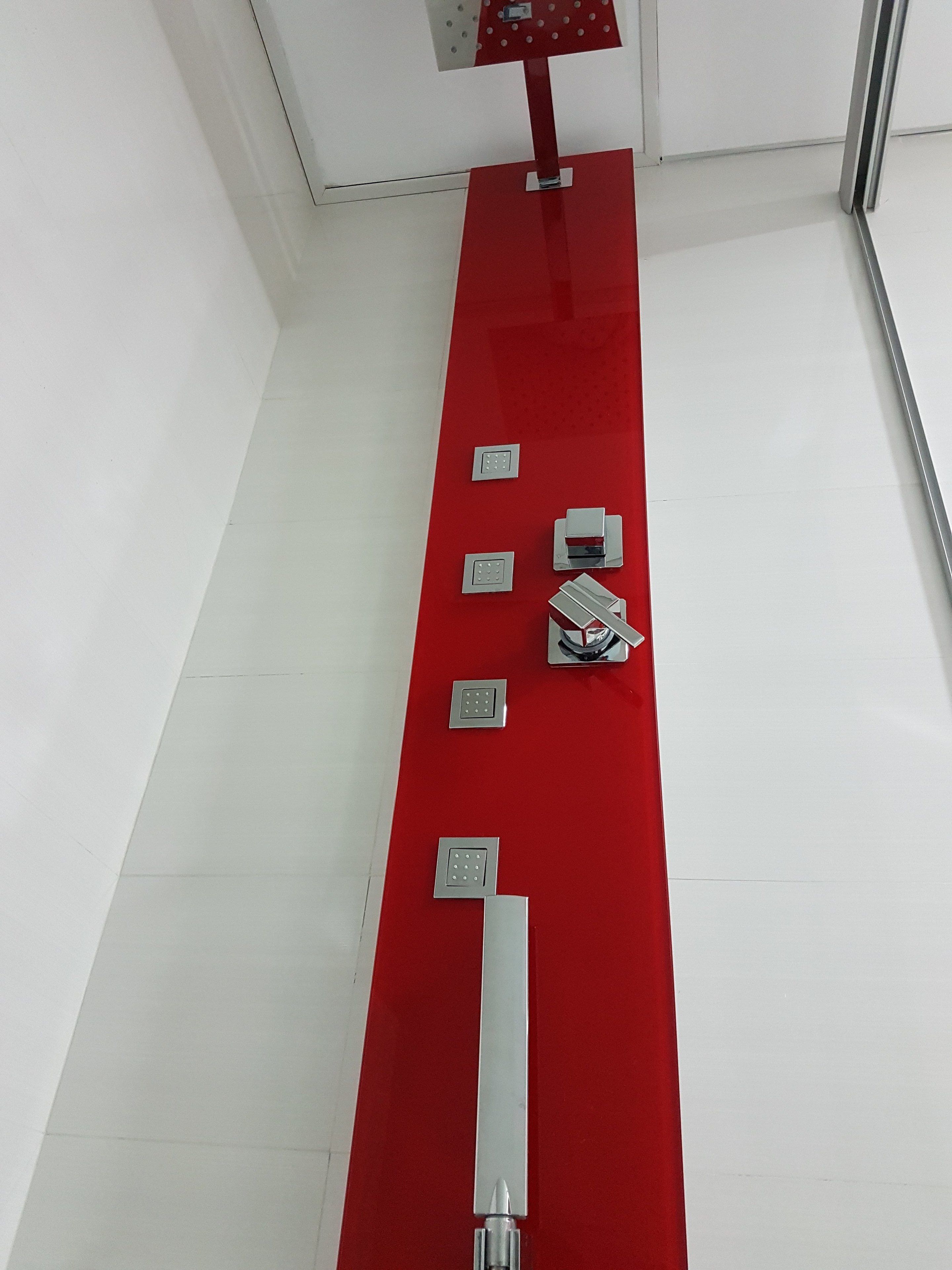 A red fire alarm panel with multiple buttons and a control lever.