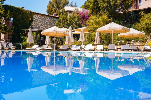 Seasonal outdoor pool, open 8:30 AM to 8:30 PM, pool umbrellas