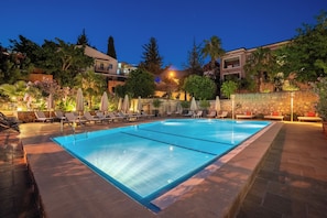 Seasonal outdoor pool, open 8:30 AM to 8:30 PM, pool umbrellas
