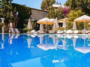 Seasonal outdoor pool, open 8:30 AM to 8:30 PM, pool umbrellas