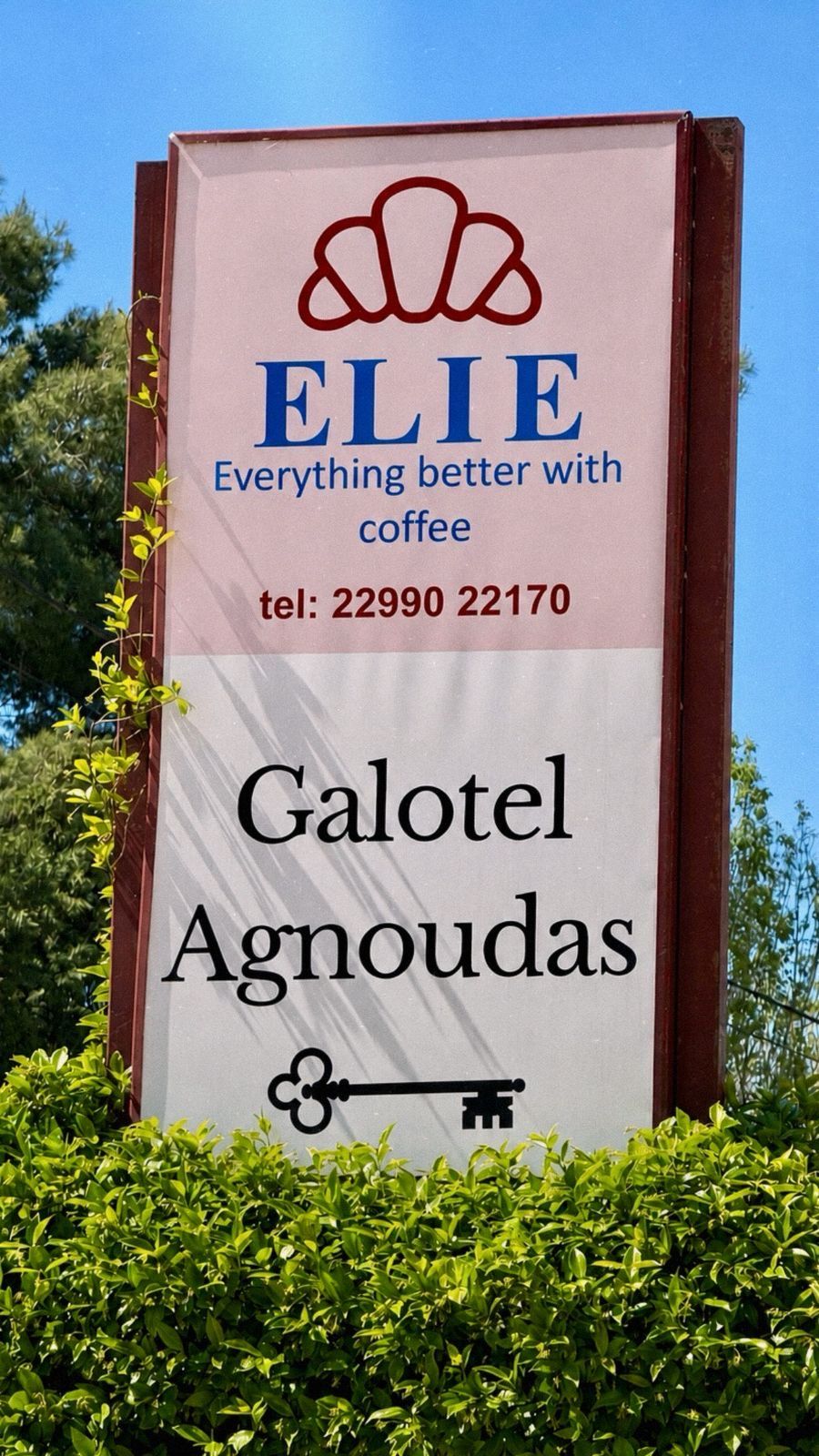 A sign for Galotel Agnoudas with a telephone number and a logo.