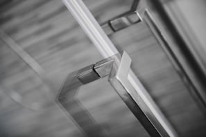A close-up of a metallic, angular object, likely part of a building's structure. - Hotel Ervill (Rimini)