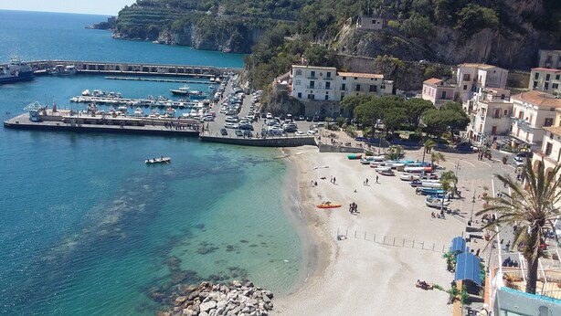 A coastal town with a marina, sandy beach, and buildings along the waterfront. - La Corte Dei Naviganti B&B - Amalfi Coast - Cetara (Cetara)