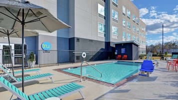 Seasonal outdoor pool, open 9:00 AM to 9:00 PM, pool umbrellas