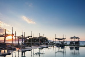Indoor pool, outdoor pool, pool umbrellas, pool loungers