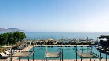 Indoor pool, outdoor pool, pool umbrellas, sun loungers