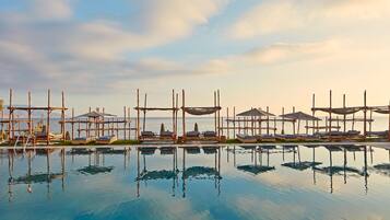 Indoor pool, outdoor pool, pool umbrellas, pool loungers