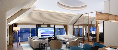 A modern hotel room with a living area featuring a sofa, chairs, a dining table, and a TV.