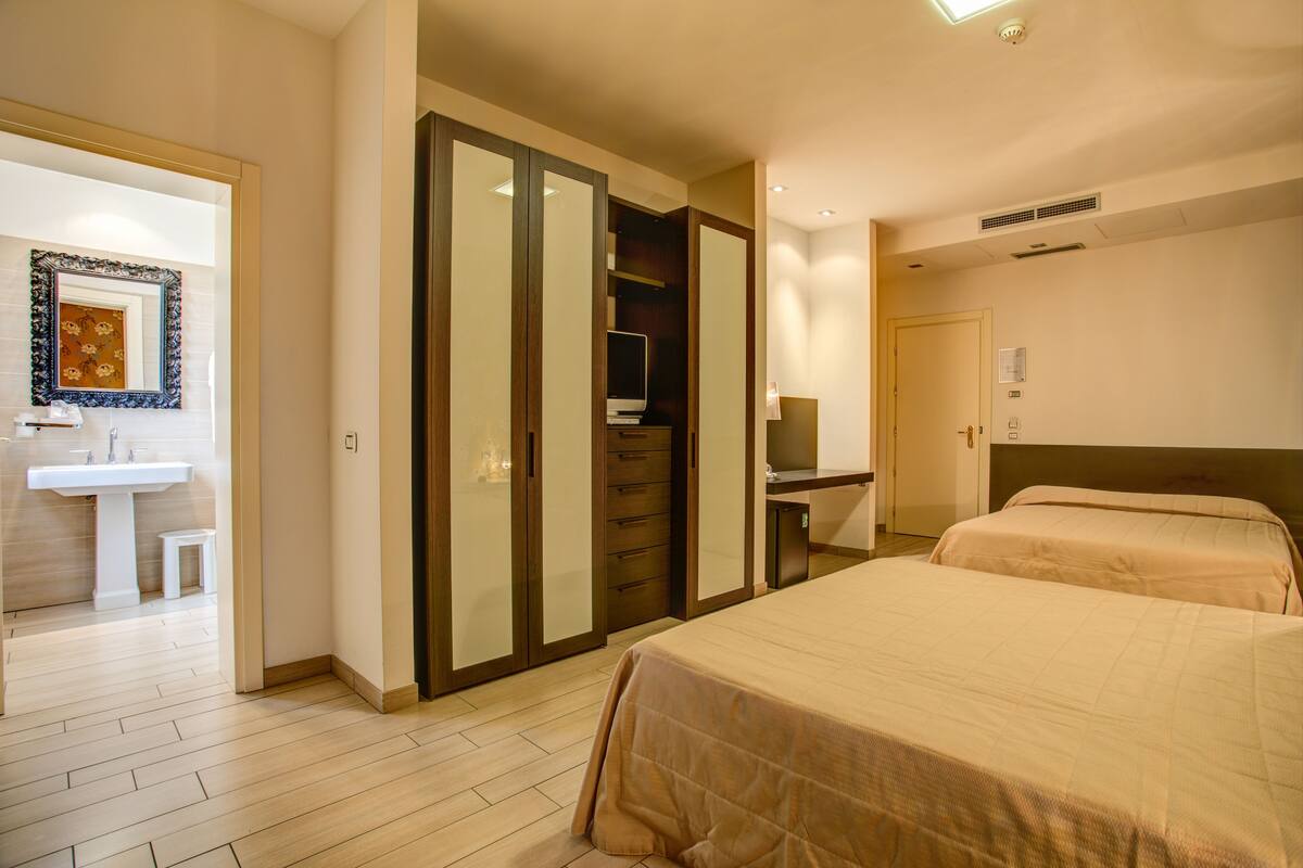 family room | minibar, in-room safe, desk, blackout curtains