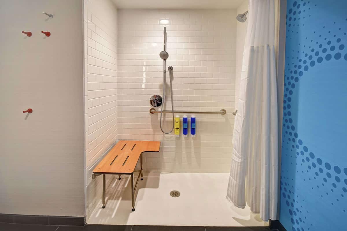 Bathroom | Shower, designer toiletries, hair dryer, towels