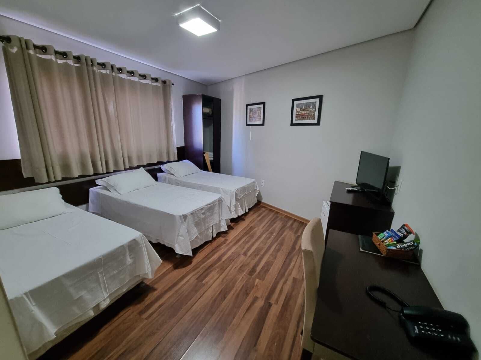 Standard Triple Room | Minibar, desk, blackout drapes, iron/ironing board