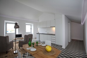 Family Suite, 1 Bedroom, Garden View (Dourado) | Living area | Flat-screen TV - Place of Moments Urban (Ponta Delgada)