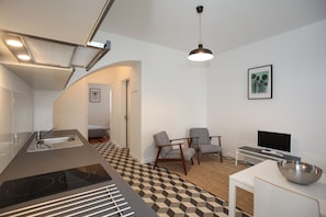 Family Suite, 1 Bedroom, Garden View, Ground Floor (Castanho) | Living area | Flat-screen TV - Place of Moments Urban (Ponta Delgada)