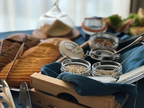 A breakfast buffet with various food items and condiments. - Blue Marine Hotel  (Rrashbull)