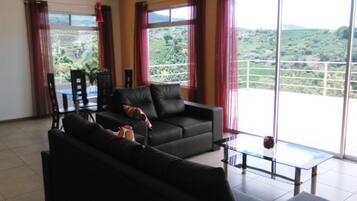 Deluxe Apartment, 2 Bedrooms | Living area | Flat-screen TV