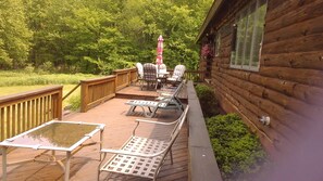 Outdoor dining - Quiet Country Log Home on three ponds.  All we overlook is the scenery.. (Parish)