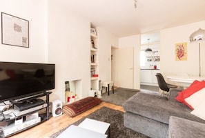 Apartment, 1 Bedroom | Living room | Flat-screen TV