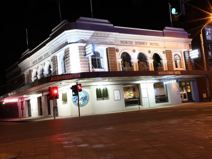 The North Sydney Hotel with a prominent entrance, a signboard, and a visible street corner.