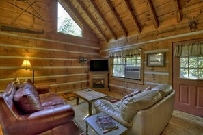 Living room with smart tv and gas fireplace