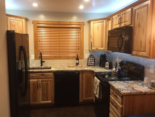 Fridge, microwave, oven, stovetop - Cowboy Condo: 2 Bedroom Whitefish Condo (Whitefish)