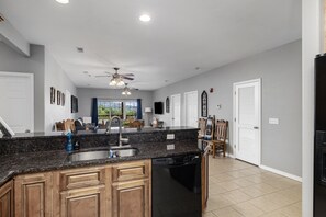 Enjoy meals in this well-equipped kitchen with a central island and dishwasher.