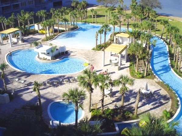 Relax by the pool surrounded by palm trees and scenic views.