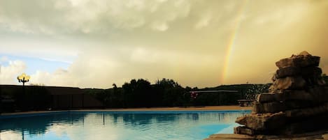Relax by the pool surrounded by a serene atmosphere and a beautiful view.
