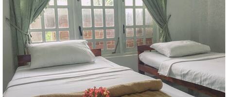 Deluxe Twin Room, 2 Twin Beds, Resort View | 1 bedroom, desk, soundproofing, free WiFi