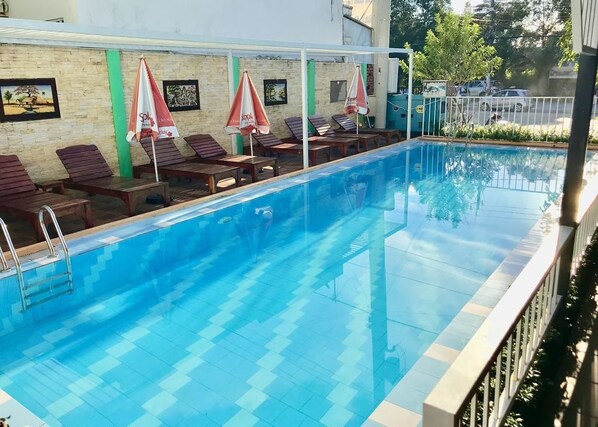 Outdoor pool, pool umbrellas, pool loungers