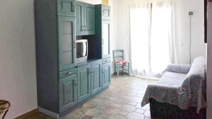 Apartamento, 2 quartos | Área de estar