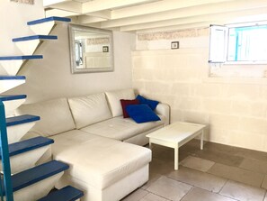 Departamento, 1 habitación | Área de sala de estar | Televisión 