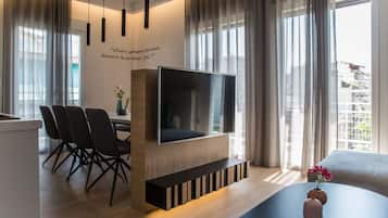 Deluxe Apartment, 4 Bedrooms, Terrace, City View | Living area | Flat-screen TV, Netflix