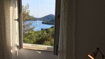 Apartment, Sea View (AP 4) | 1 bedroom, desk, iron/ironing board, free cribs/infant beds