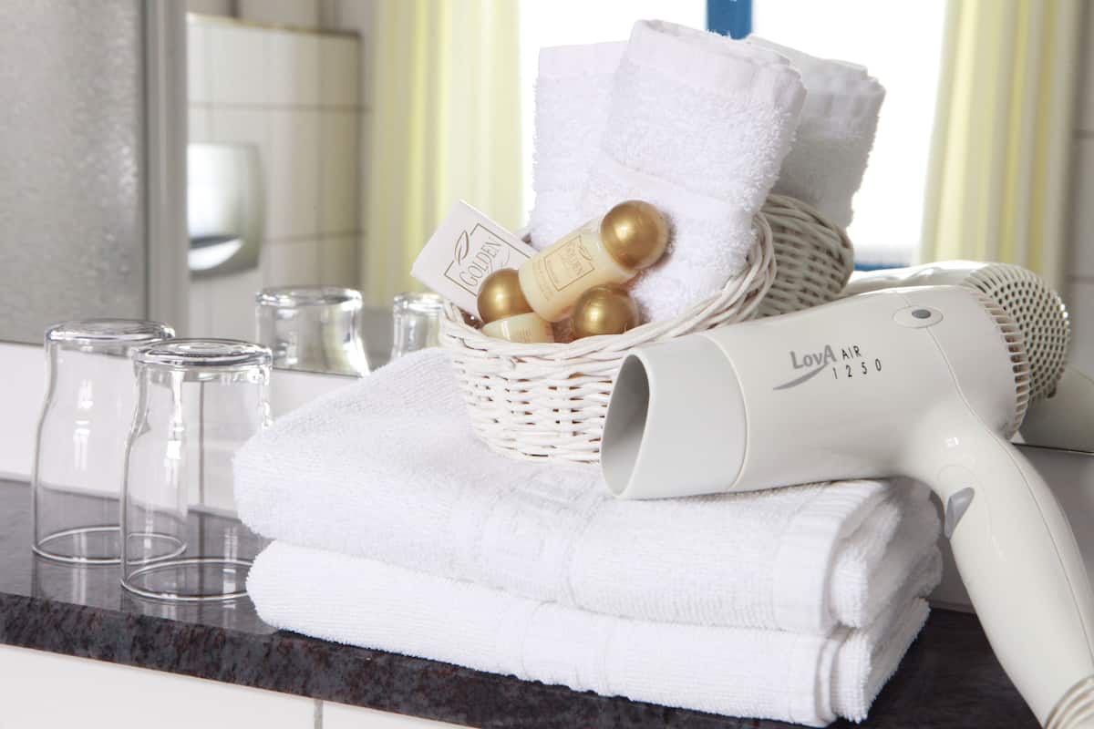 eco-friendly toiletries, hair dryer, towels