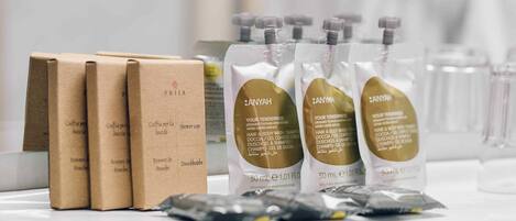 A display of hair care products including shampoo and conditioner bottles, and cardboard boxes.