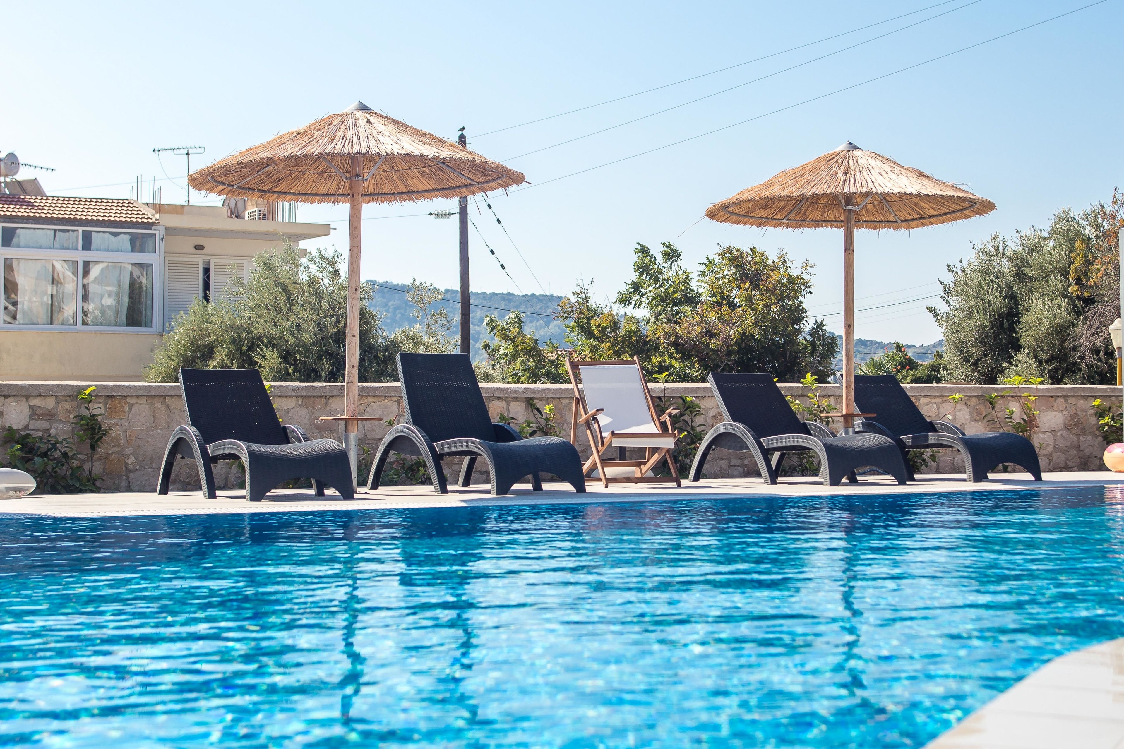 seasonal outdoor pool, pool umbrellas, pool loungers