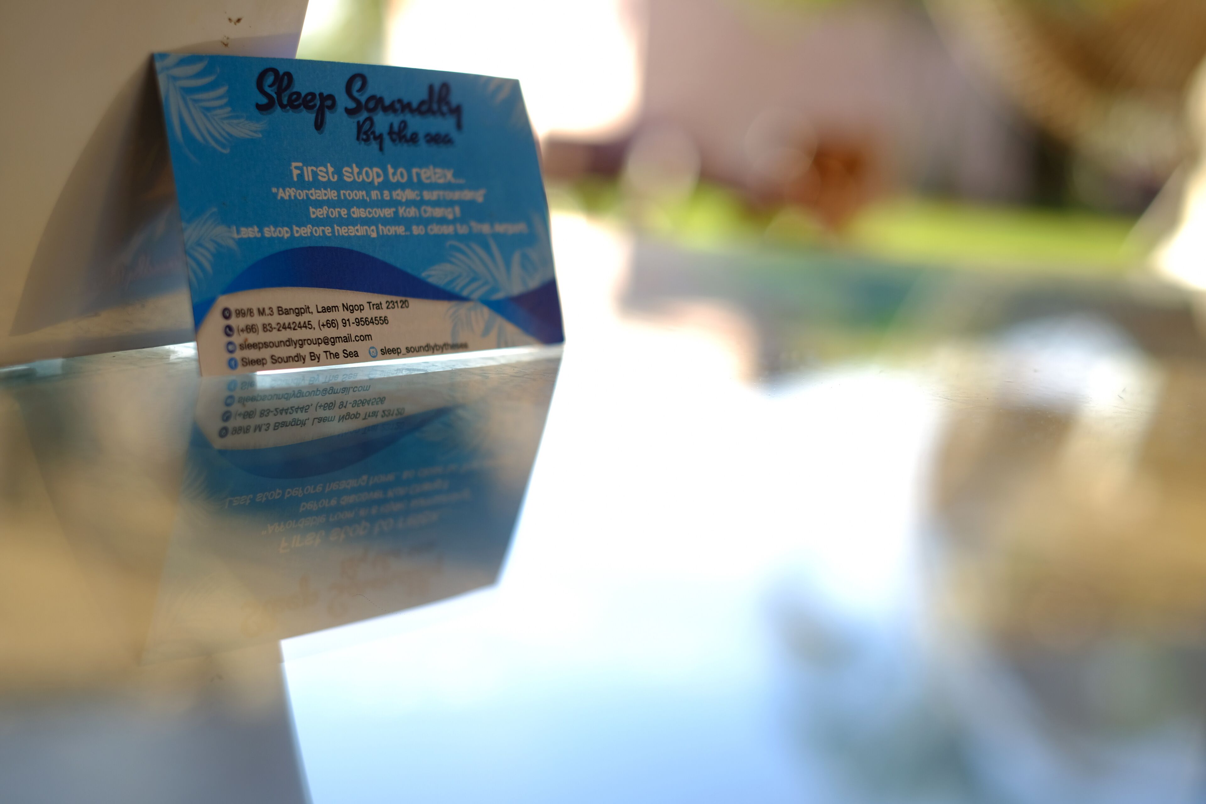 A brochure titled "Sleep Soundly by the Sea" with contact information and a website URL.